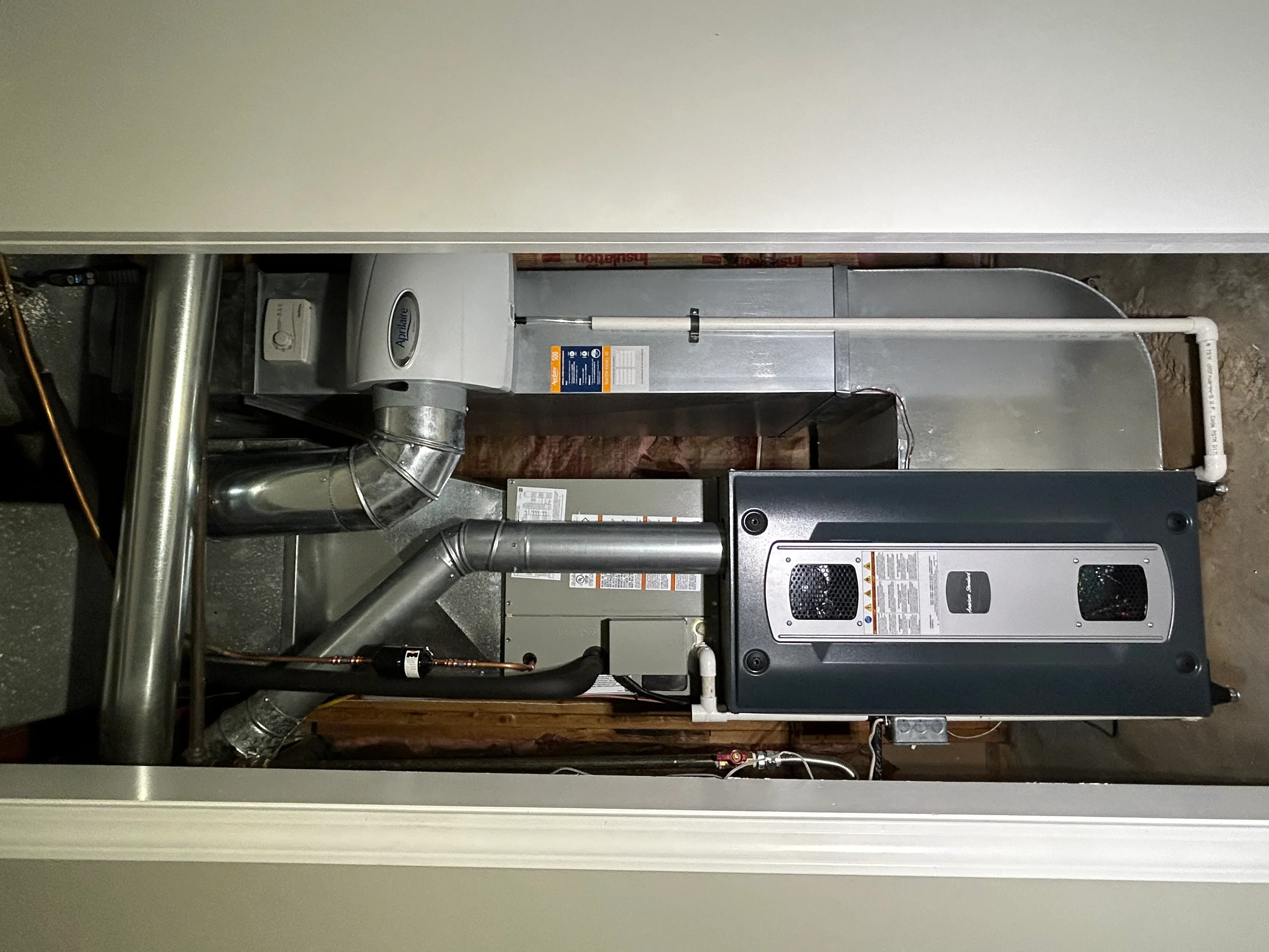 High-efficiency furnace with metal ductwork, electronic controls, and sealed connections